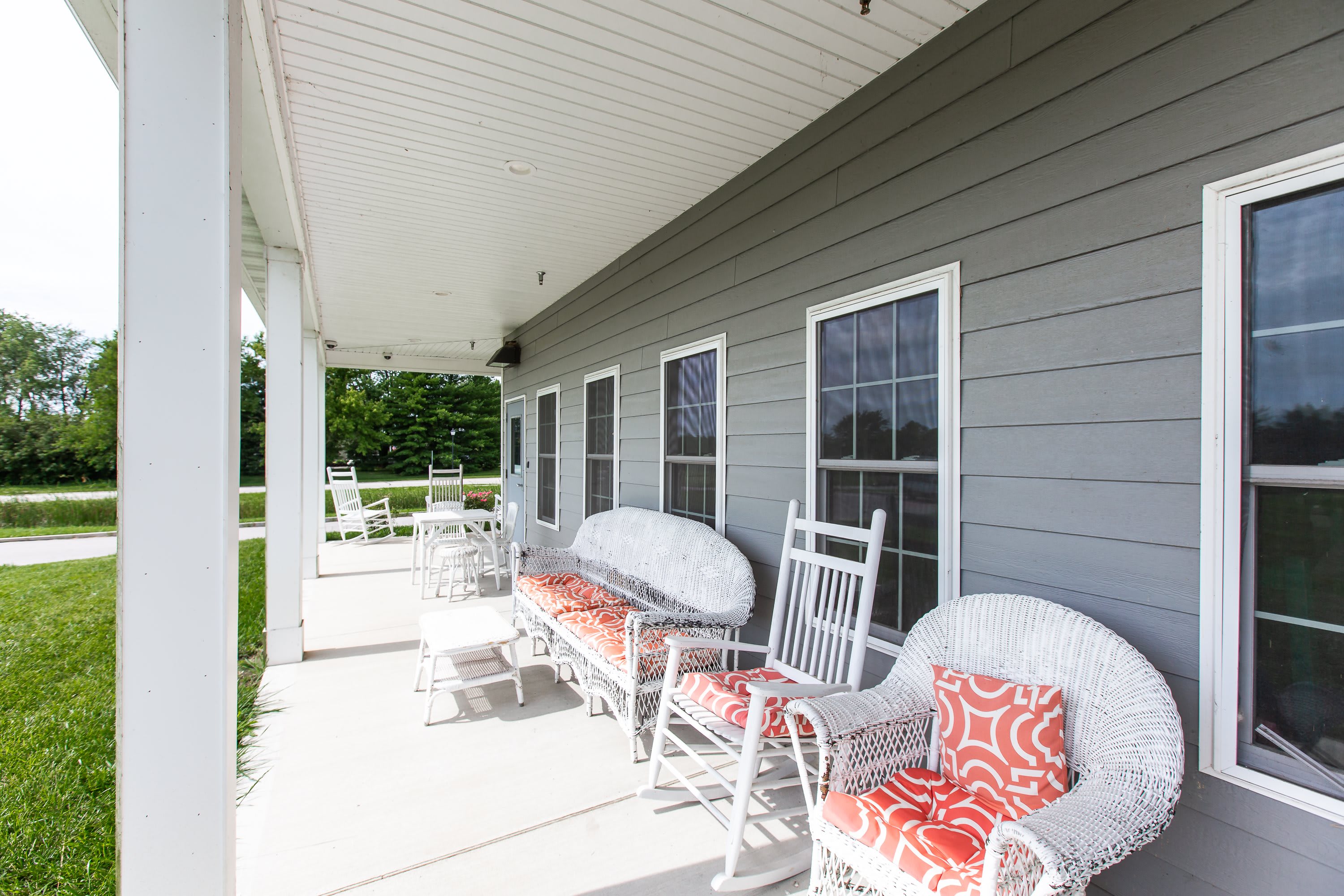 Covered front porch with rocking chairs